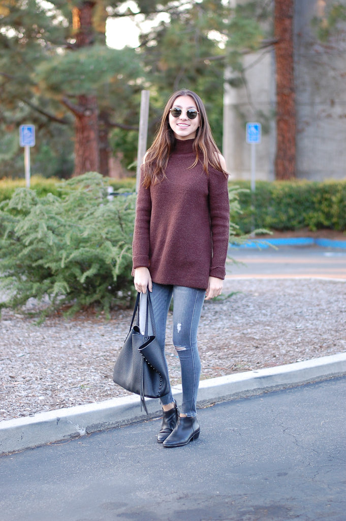 brown sweater gray jeans