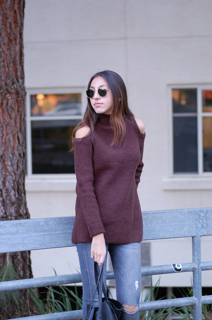 brown sweater gray jeans top lean